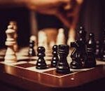 Close-up of a chessboard showcasing strategy, tactics, and focus in a competitive game.
